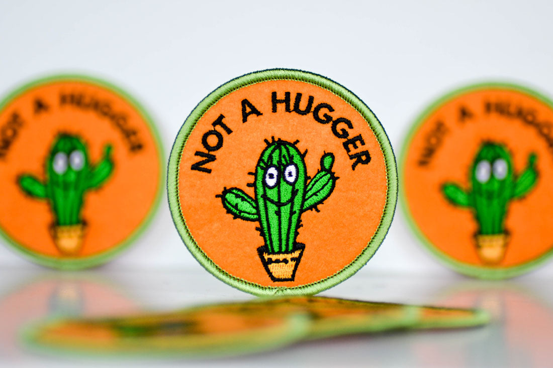 Not a hugger... Patch.  Case Pack of 8