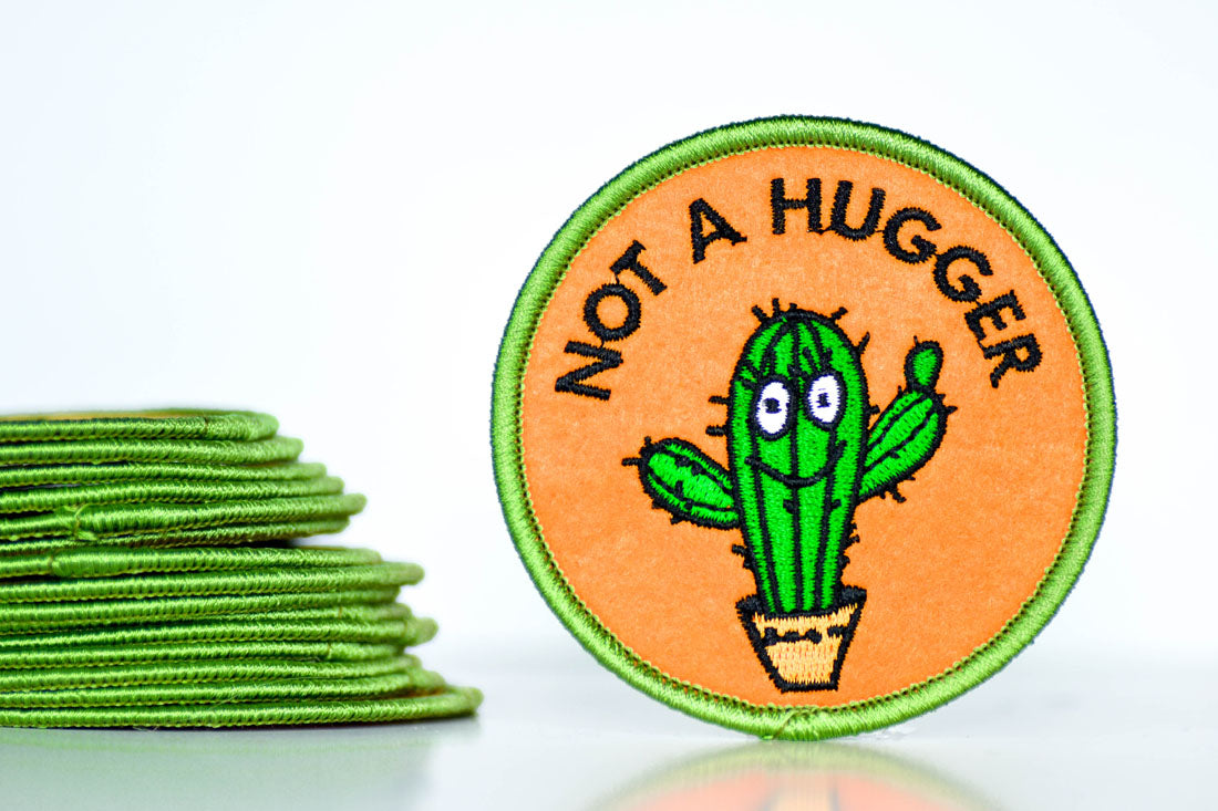 Not a hugger... Patch.  Case Pack of 8